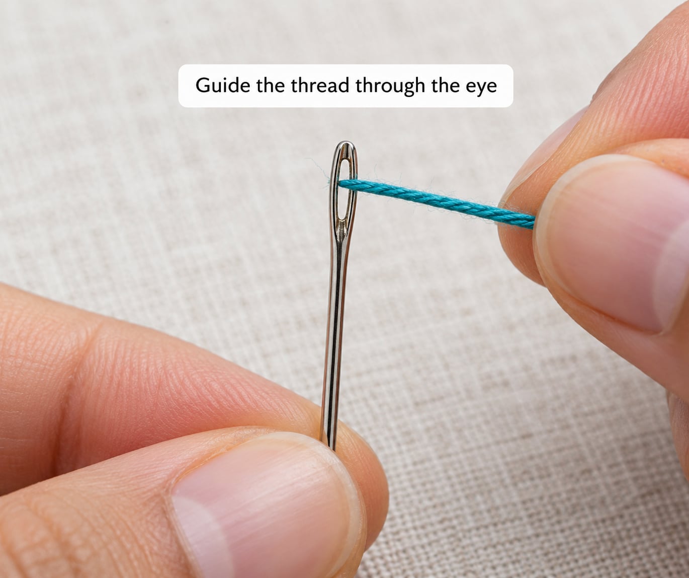 Guide the thread through the eye